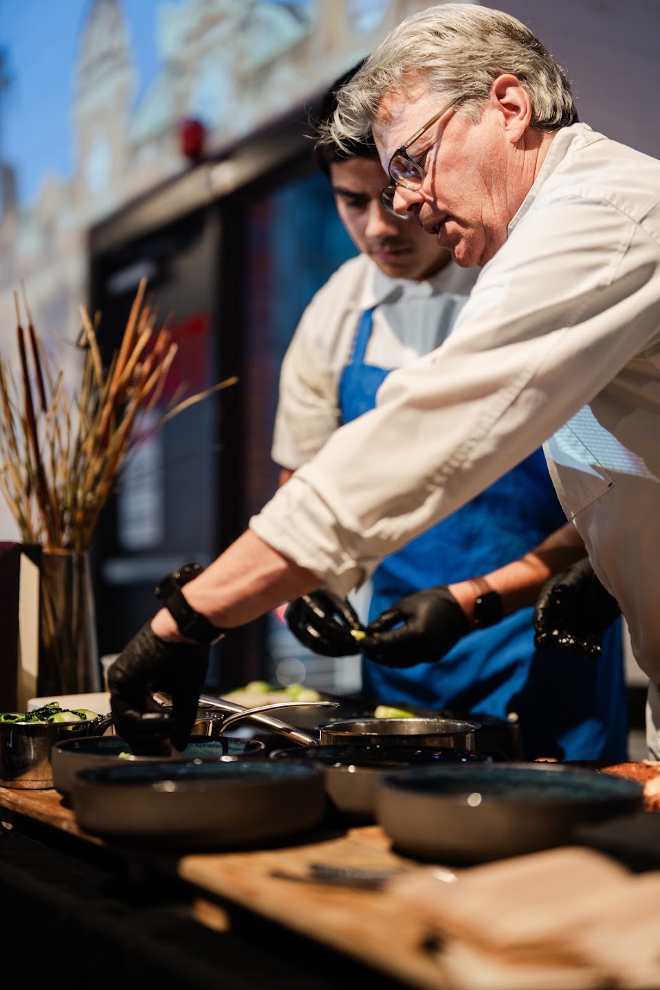 A chef preparing a tasting at Beaujolais & Beyond in Denver
